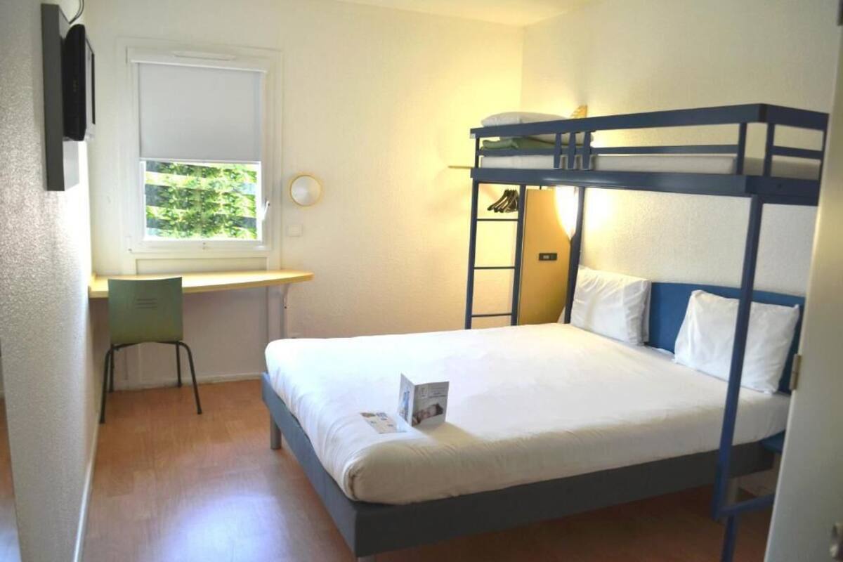 Premium bedding, desk, laptop workspace, blackout curtains