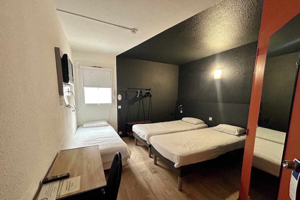 Premium bedding, desk, laptop workspace, blackout curtains