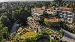 A hotel with a modern design, featuring multiple levels and a rooftop terrace. - Sthala, A Tribute Portfolio Hotel, Ubud Bali (Ubud)