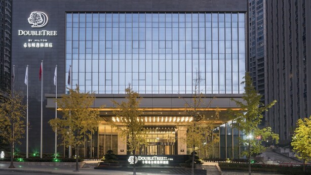 A modern hotel building with the name "DOUBLETREE BY HILTON" prominently displayed. - DoubleTree by Hilton Hotel Shiyan (Shiyan)