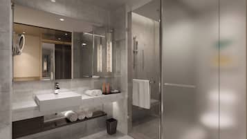 Suite, 1 King Bed, City View | Bathroom | Designer toiletries, hair dryer, bathrobes, slippers