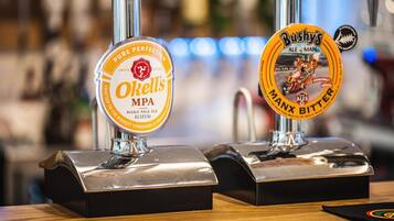 Two beer taps with labels: O'Kelly's MPA and Bushy's Ale of Man.