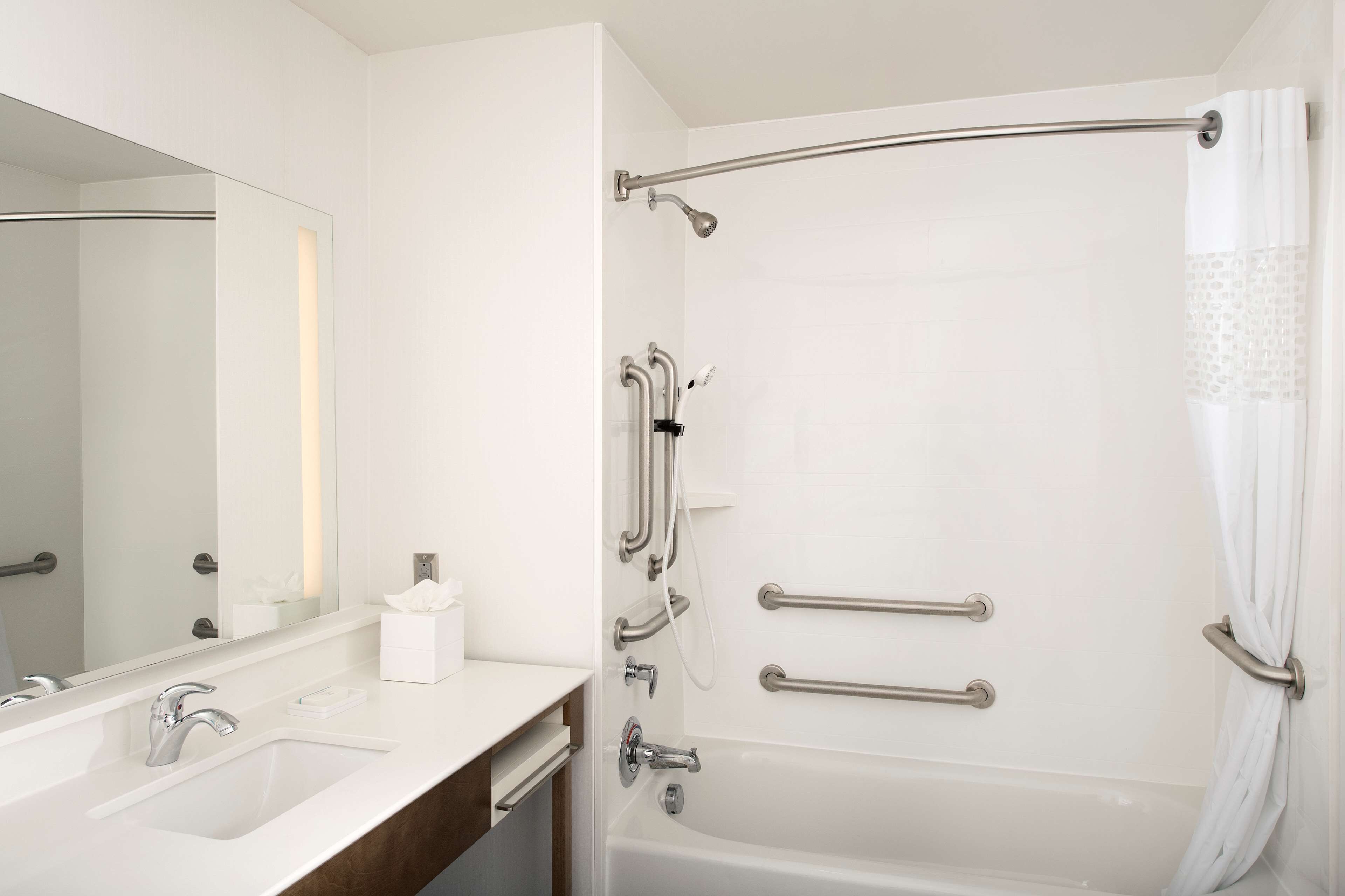 deep-soaking bathtub, rainfall showerhead, free toiletries, hair dryer