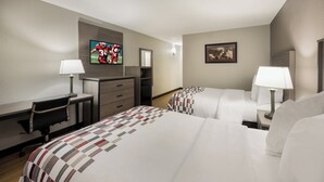 A hotel room with two beds, a desk, a chair, a TV, and a painting on the wall. - Red Roof Inn Dumfries - Quantico (Dumfries)