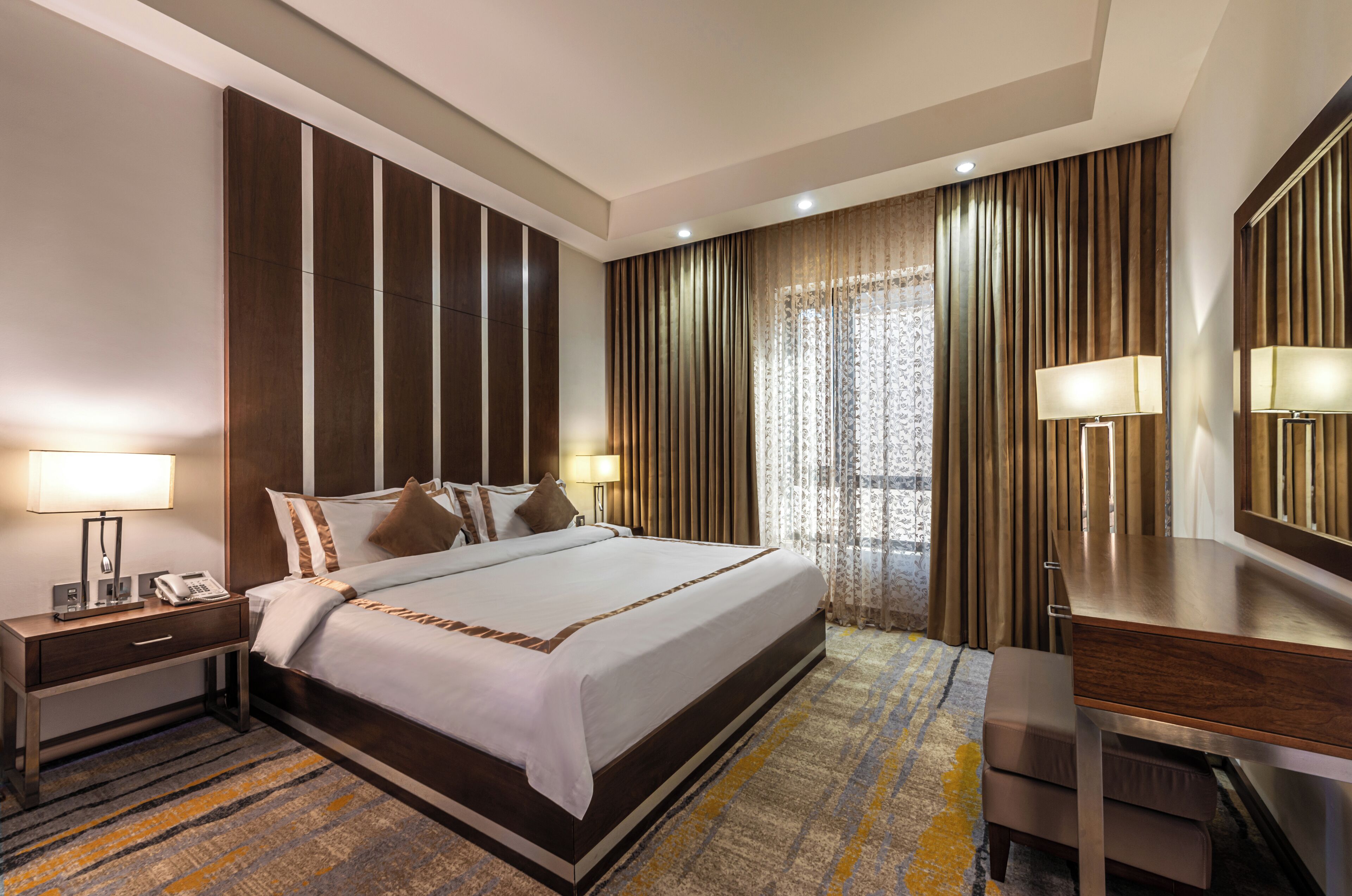 deluxe double or twin room | minibar, in-room safe, desk, blackout curtains