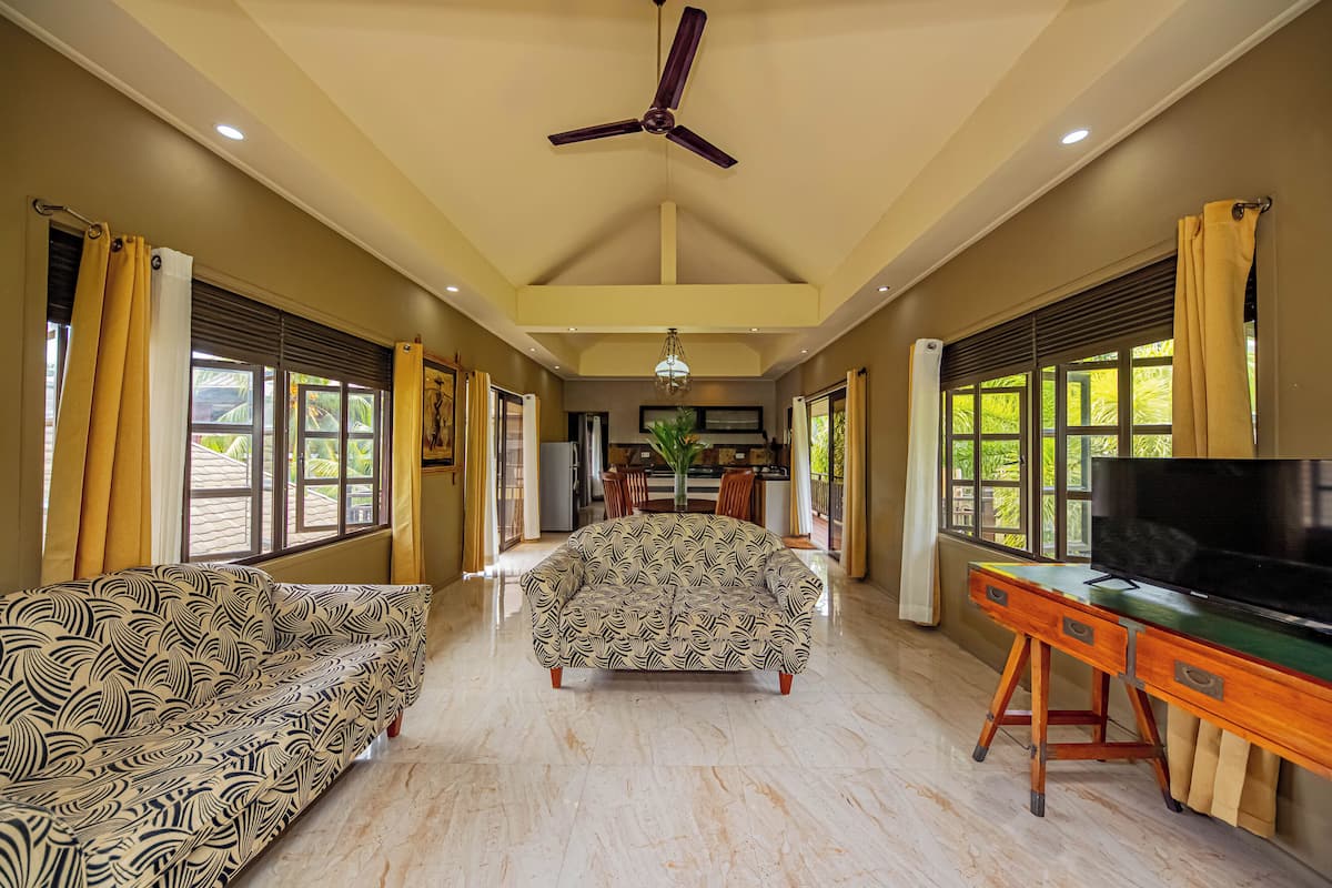 Apartment, 1 King Bed, Sea View, Beachfront | Living area | 40-inch LED TV with cable channels, TV