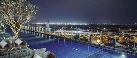 Outdoor pool, open 6:00 AM to 10:00 PM, pool umbrellas, sun loungers