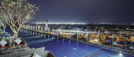 Outdoor pool, open 6:00 AM to 10:00 PM, pool umbrellas, pool loungers