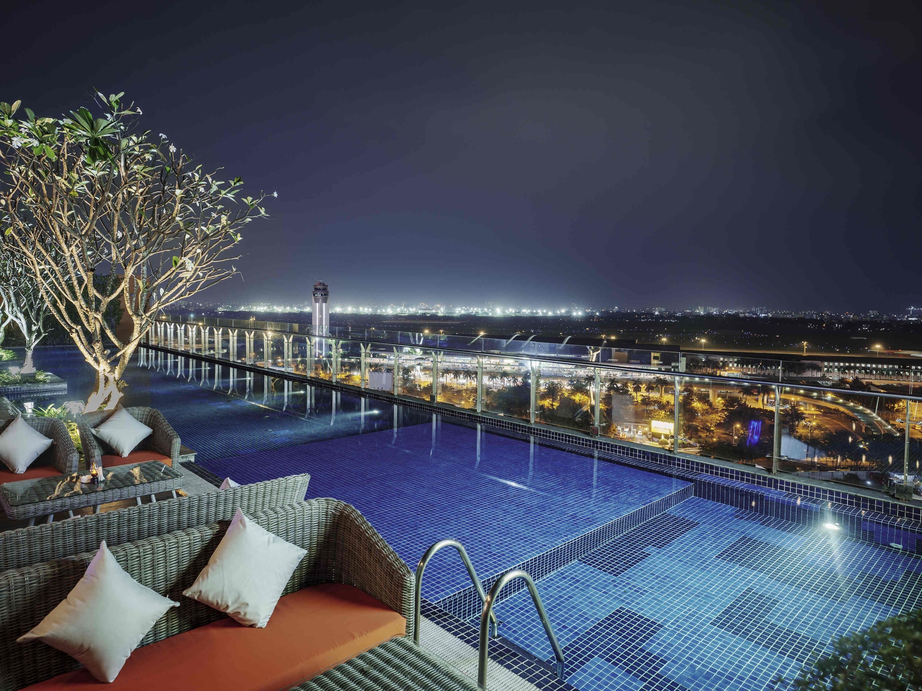 Outdoor pool, open 6:00 AM to 10:00 PM, pool umbrellas, sun loungers