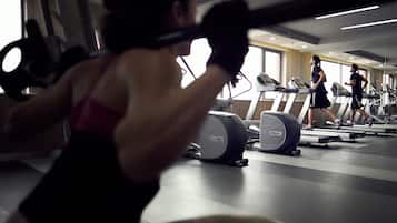 A gym with treadmills and exercise equipment.