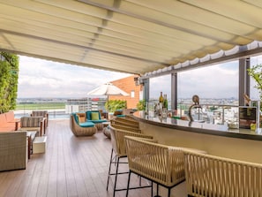 Rooftop bar, pool views, open daily