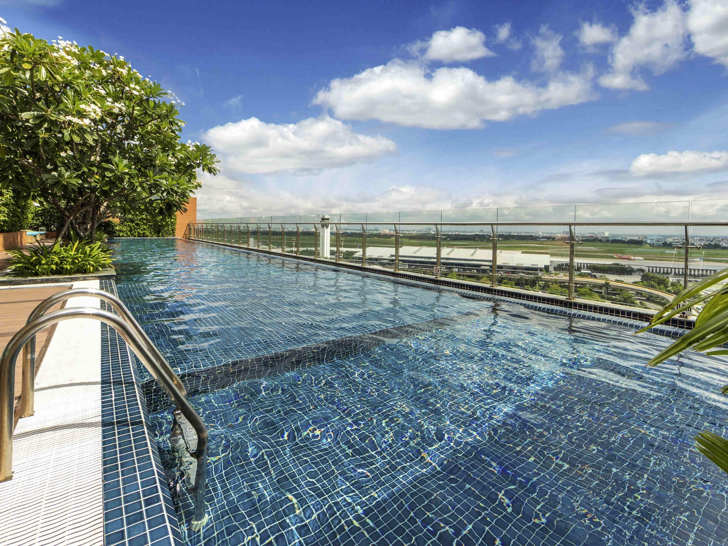 Outdoor pool, open 6:00 AM to 10:00 PM, pool umbrellas, sun loungers
