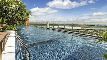 Outdoor pool, open 6:00 AM to 10:00 PM, pool umbrellas, sun loungers