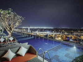 Outdoor pool, open 6:00 AM to 10:00 PM, pool umbrellas, pool loungers