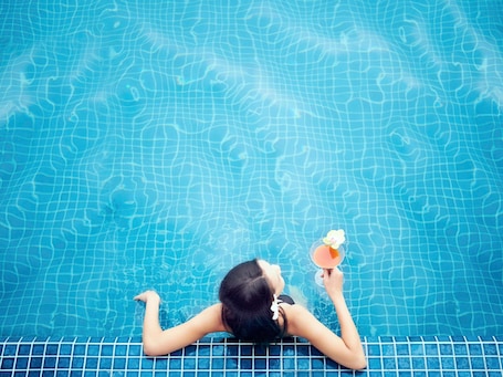 Outdoor pool, open 6:00 AM to 10:00 PM, pool umbrellas, pool loungers. ibis Saigon Airport