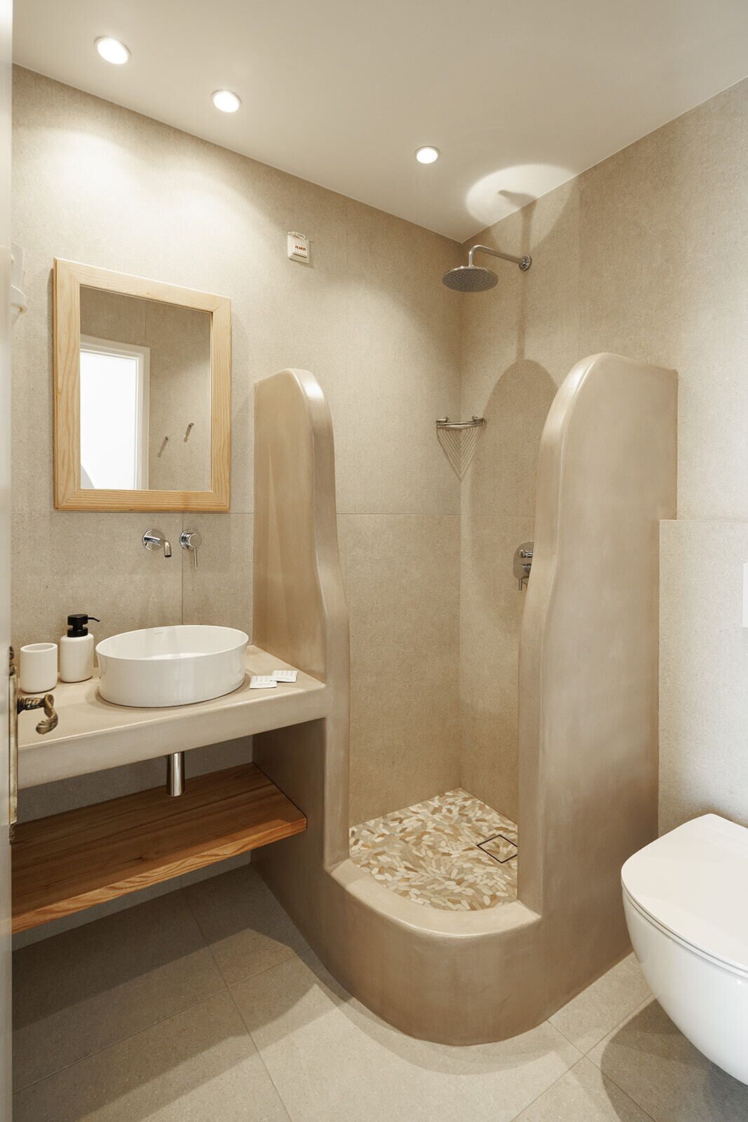 A modern bathroom with a freestanding sink, a shower enclosure, and a toilet.