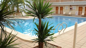 Indoor pool, outdoor pool, pool umbrellas, pool loungers