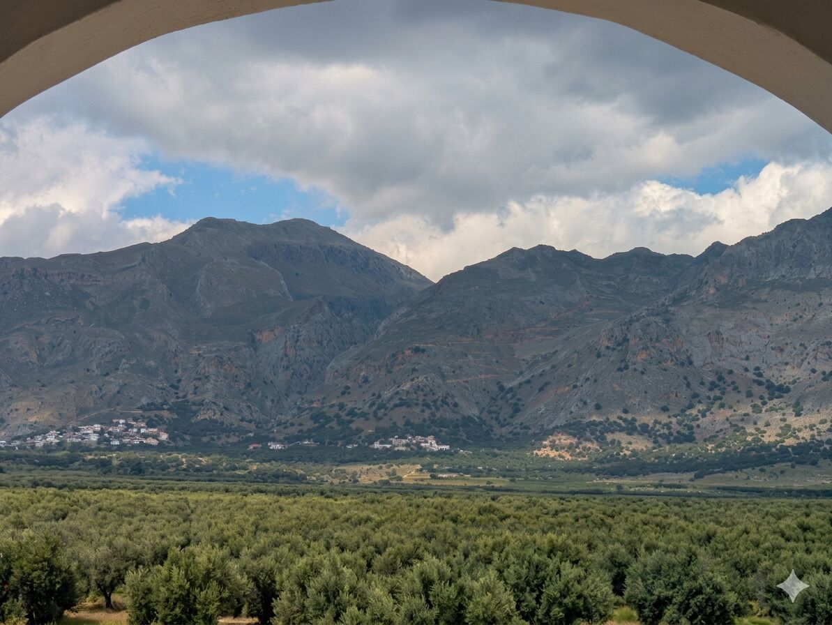 A mountainous landscape with a village in the valley.