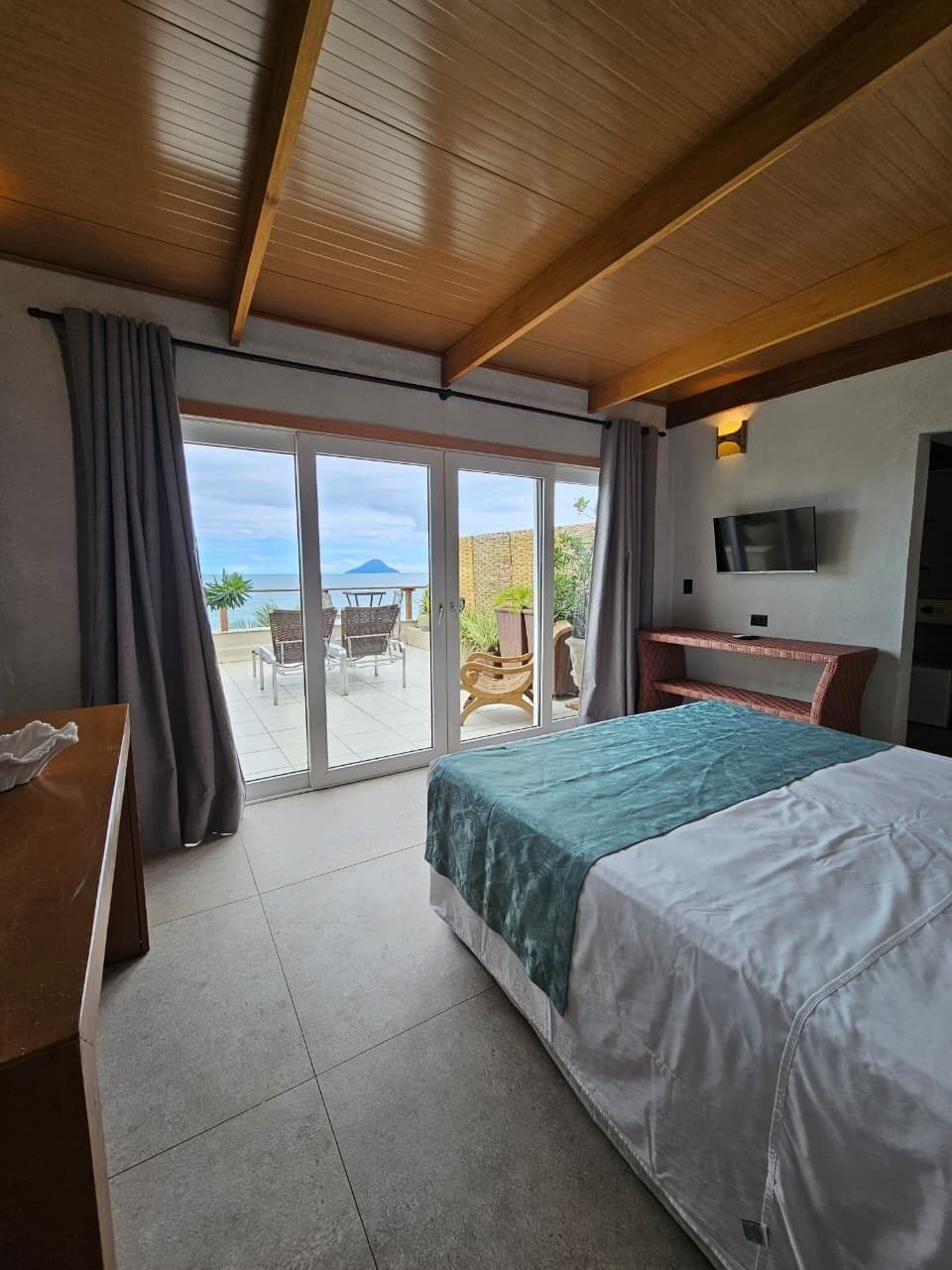 Elite Room, Patio, Sea View | Minibar, in-room safe, soundproofing, bed sheets