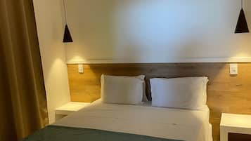 Junior kamer | Een minibar, een kluis op de kamer, geluiddichte muren, beddengoed