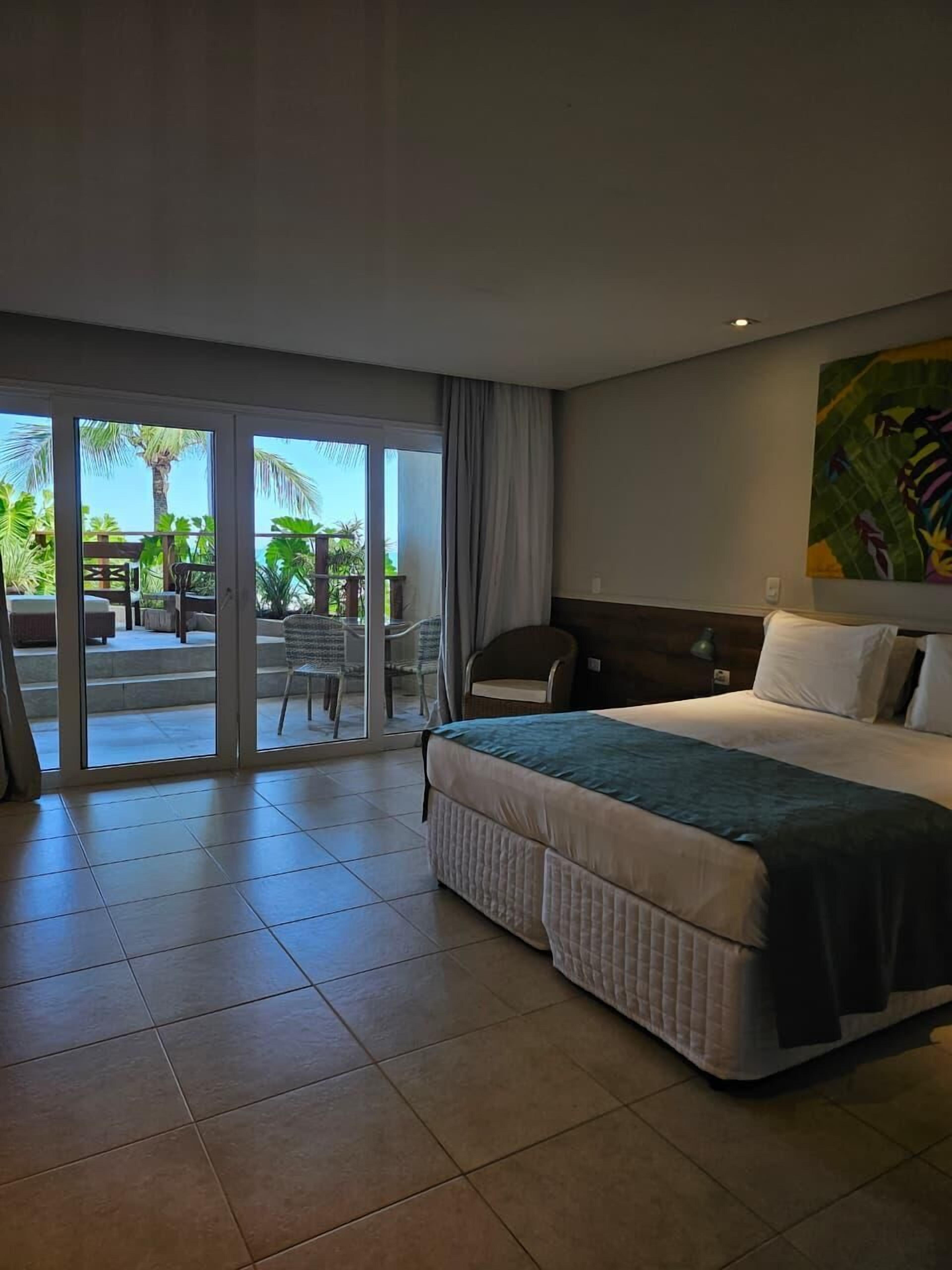 Chambre exclusive, patio, vue sur la mer | Minibar, coffre-fort, système d’insonorisation, literie fournie