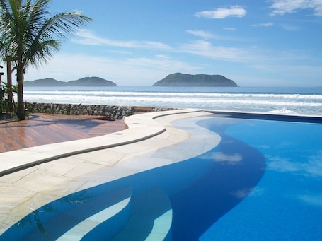 Outdoor pool, open 11:00 AM to 8:00 PM, pool umbrellas