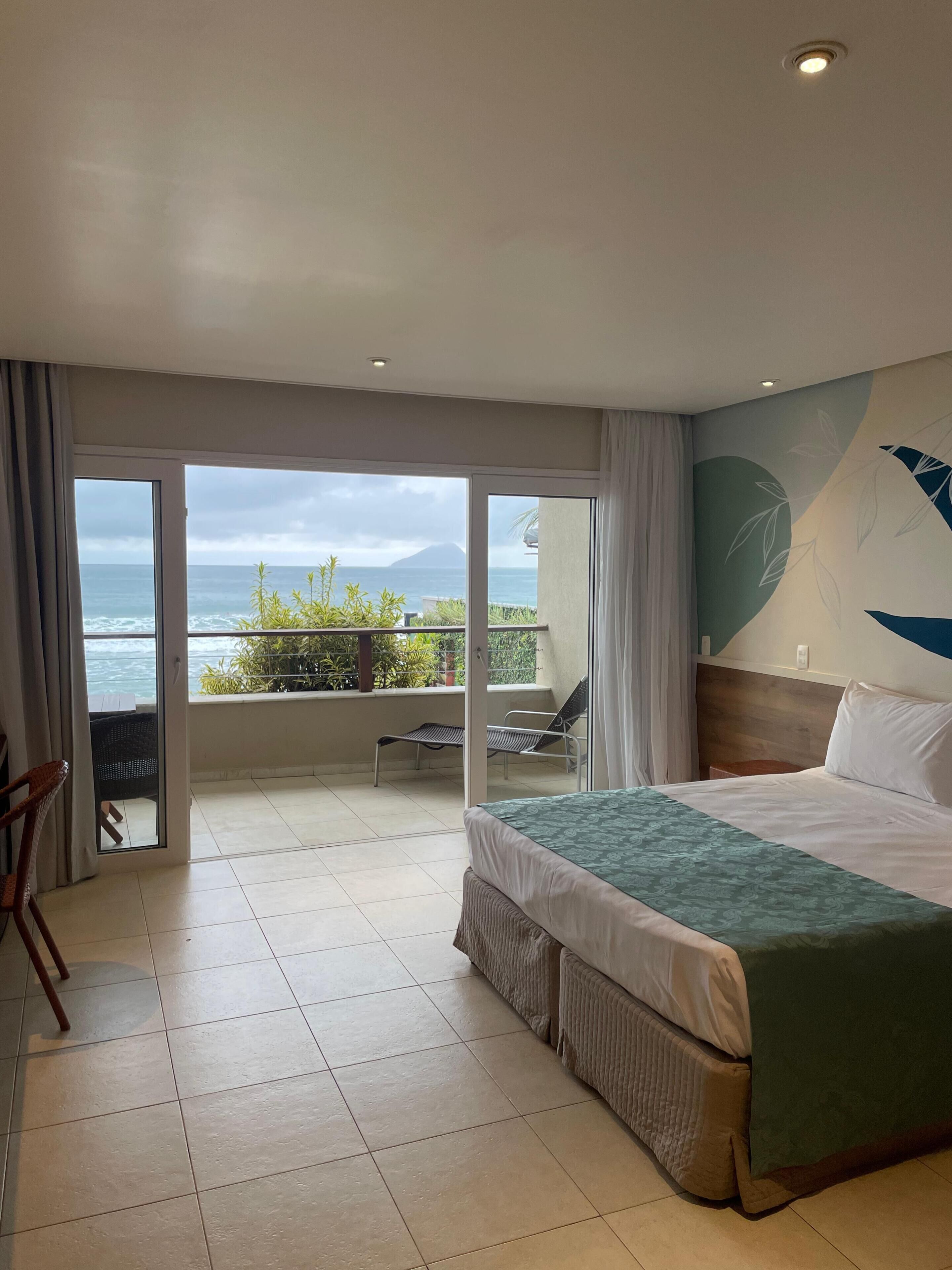 Premium Room, Patio, Sea View | Minibar, in-room safe, soundproofing, bed sheets