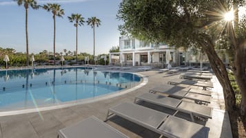 Seasonal outdoor pool, open 8:30 AM to 6:00 PM, pool umbrellas