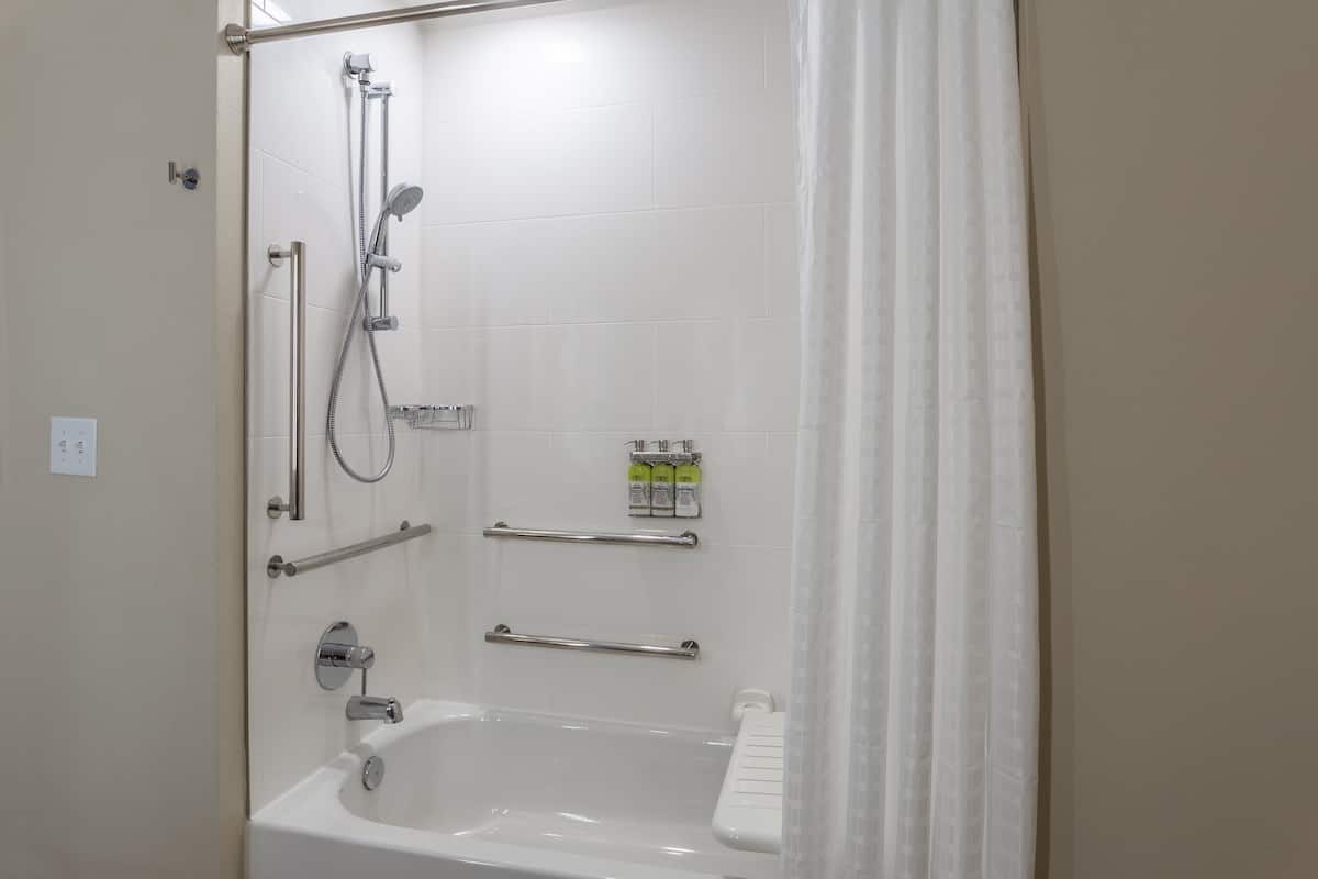 A modern shower area with a glass door, a handheld showerhead, a handheld showerhead, a handheld showerhead, a handheld showerhead, a handheld showerhead, a handheld showerhead, a handheld showerhead, a handheld showerhead, a handheld showerhead, a handheld showerhead, a handheld showerhead, a handheld showerhead, a handheld showerhead, a handheld showerhead, a handheld showerhead, a handheld showerhead, a handheld showerhead, a handheld showerhead, a handheld showerhead, a handheld showerhead, a handheld showerhead, a handheld showerhead, a handheld showerhead, a handheld showerhead, a handheld showerhead, a handheld showerhead, a handheld showerhead, a handheld showerhead, a handheld showerhead, a handheld showerhead, a handheld showerhead, a handheld showerhead, a handheld showerhead, a handheld showerhead, a handheld showerhead, a handheld showerhead, a handheld showerhead, a handheld shower