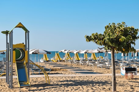 On the beach, sun loungers, beach umbrellas, beach towels