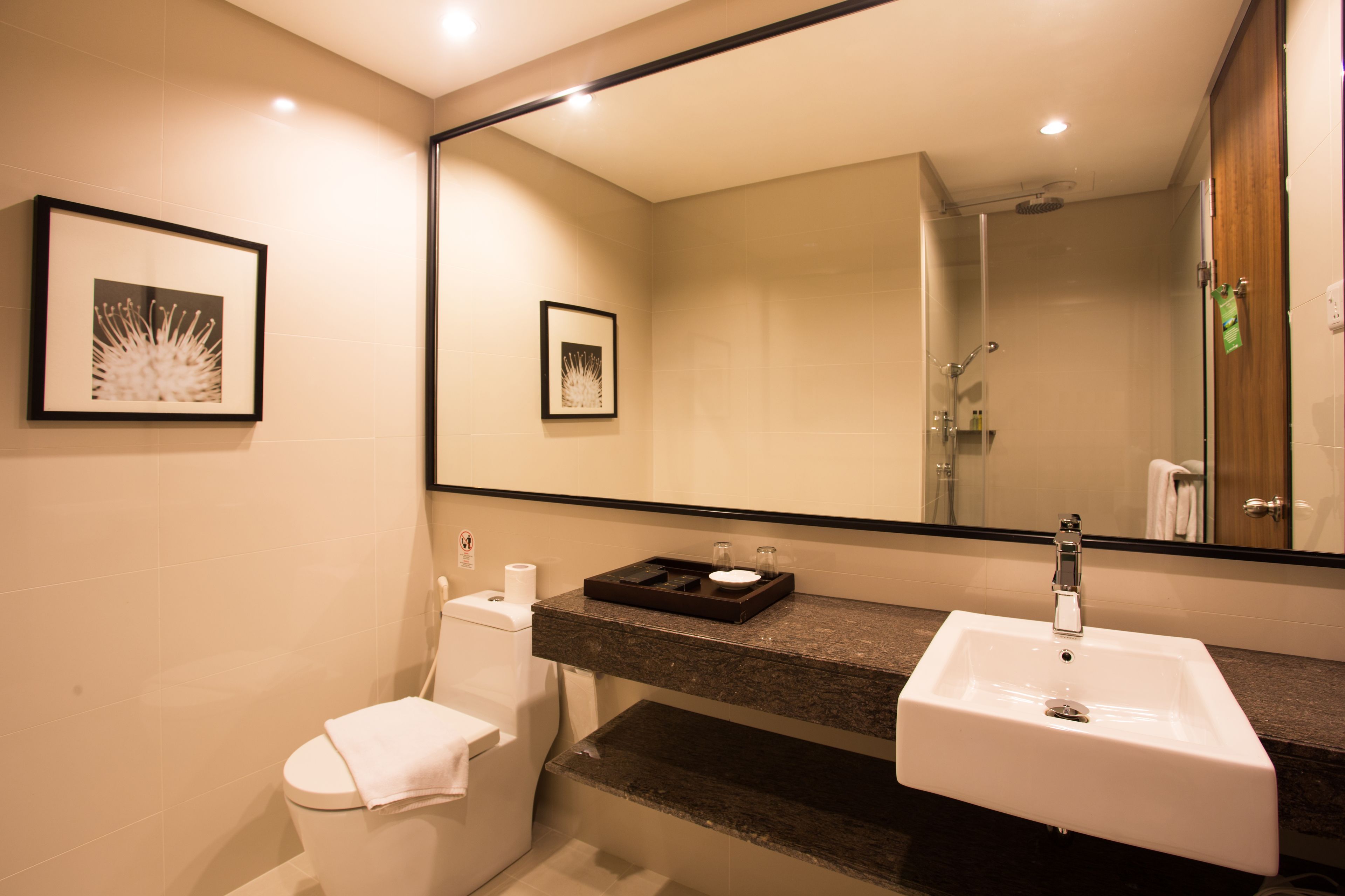 deluxe room, 1 king bed | bathroom | free toiletries, towels