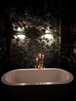 Deluxe Suite | Living area | 32-inch flat-screen TV with cable channels, TV