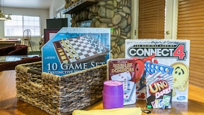 A table with a chess set, Connect 4 game, dominoes, and a banana-shaped bag. - Inside Yosemite Lower Cascades (Yosemite National Park)