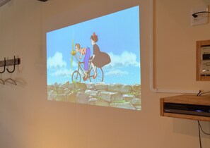 A projection of an animated scene on a wall. - Anchor Site (Takayama)