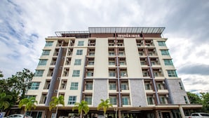 A multi-story hotel with a modern design, featuring a prominent entrance, multiple balconies, and a covered parking area. - Central place serviced apartment 1 (Chonburi)