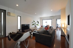 Premium Suite, 2 Bedrooms, Hill View | Living area | 50-inch flat-screen TV with cable channels, TV, Netflix - The White Reef (Uruma)