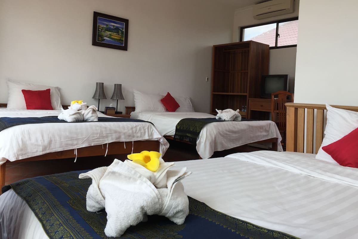 Triple Room | Minibar, blackout drapes, free WiFi