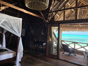 Deluxe Double Room, Ocean View, Beachside | 1 bedroom, in-room safe, free WiFi, bed sheets