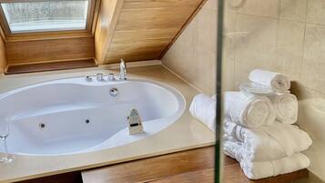 Deluxe Suite, Jetted Tub | Minibar, in-room safe, desk, laptop workspace