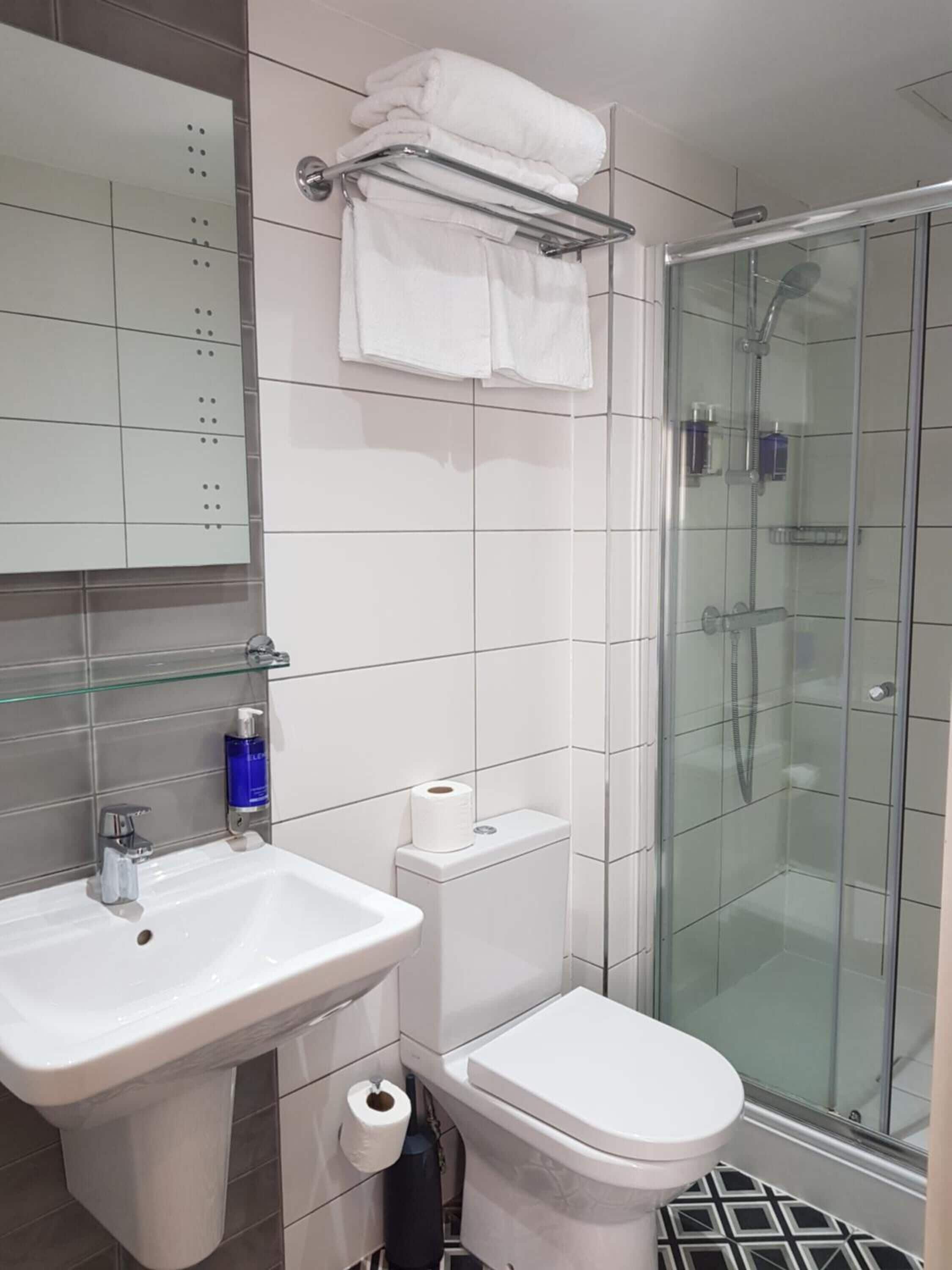 shower, free toiletries, hair dryer, towels