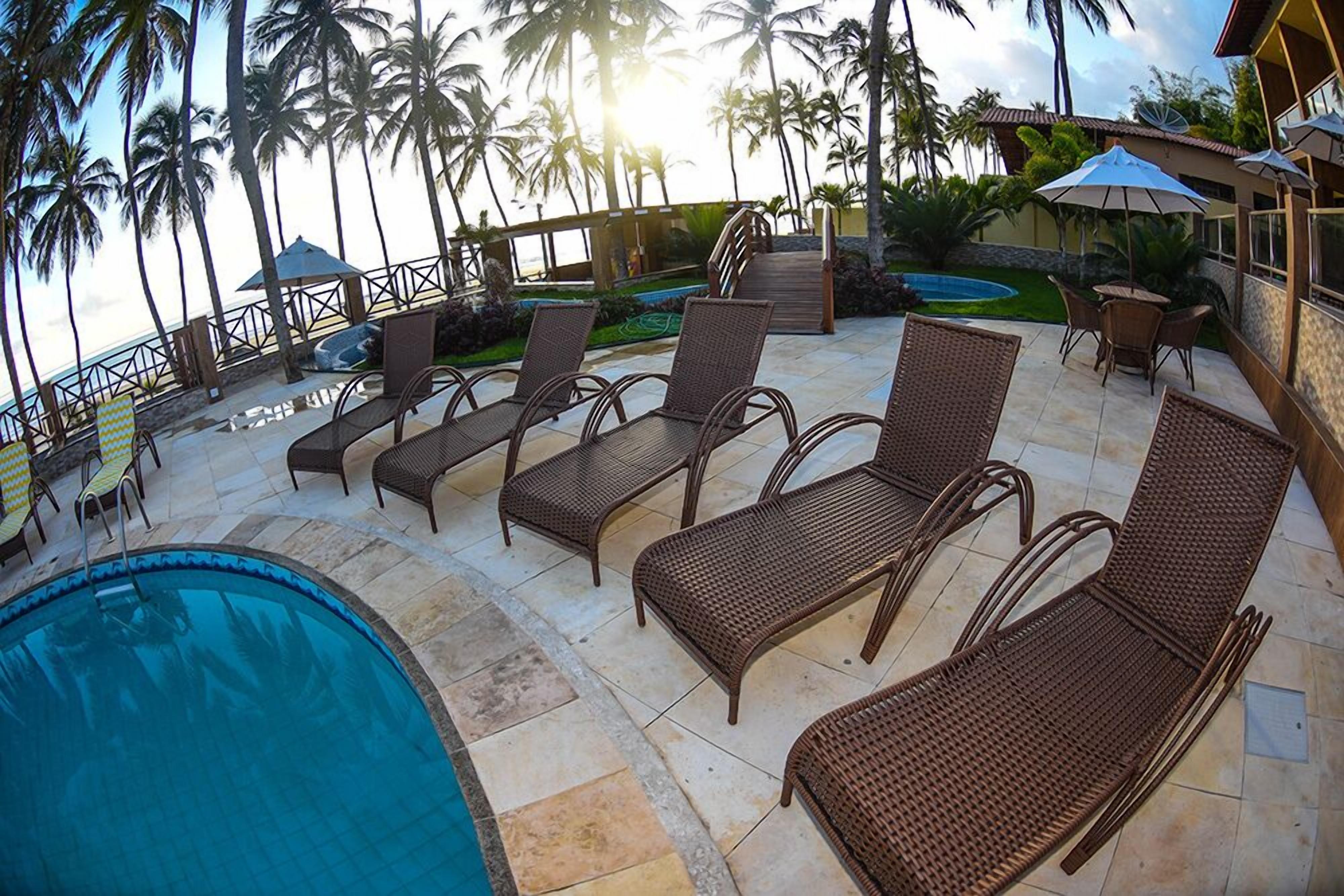 outdoor pool, pool umbrellas, pool loungers