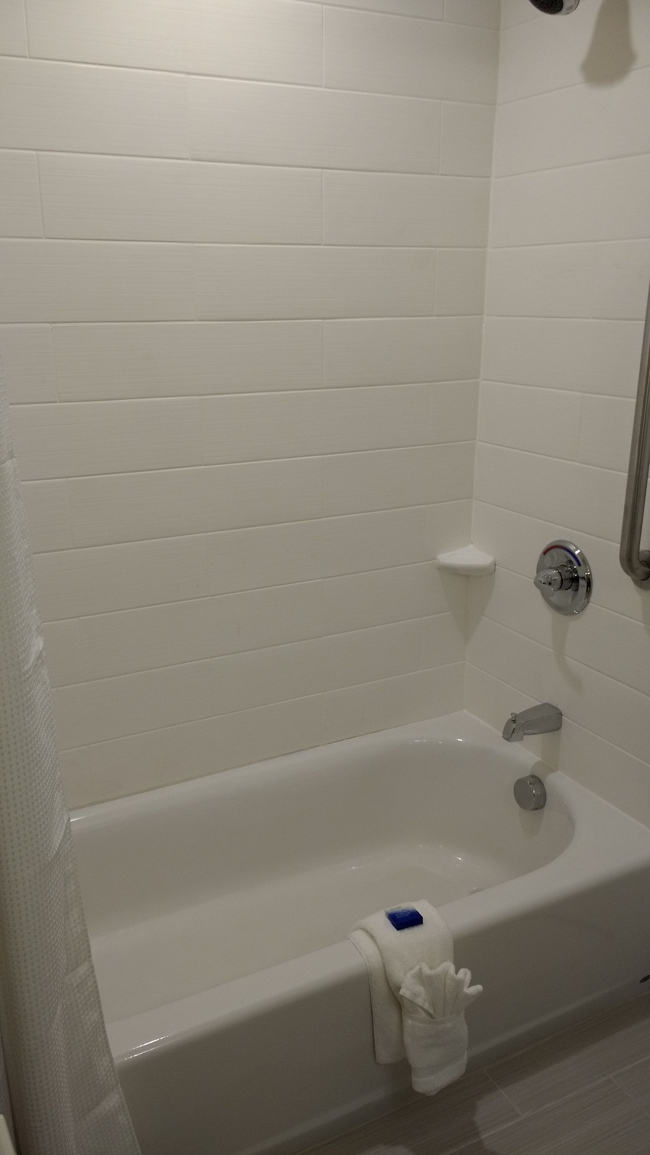 designer toiletries, hair dryer, towels