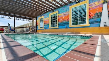 Outdoor pool, open 9:00 AM to 9:00 PM, pool loungers