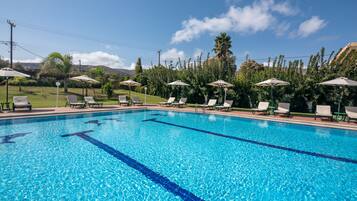 Seasonal outdoor pool, pool umbrellas, sun loungers