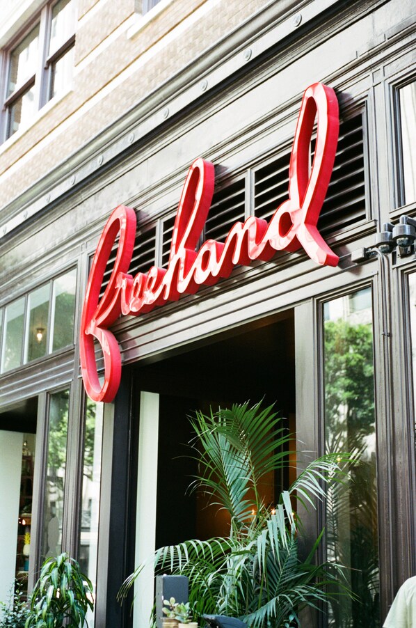 A building with a large red sign that reads "Crockham". - Freehand Los Angeles (Los Angeles)