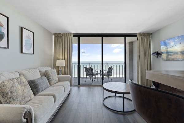 Signature Condo, 1 Bedroom, Balcony, Beachside | Living room | 42-inch flat-screen TV with cable channels, TV