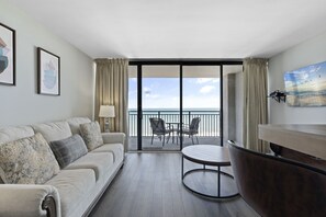 Signature Condo, 1 Bedroom, Balcony, Beachside | Living room | 42-inch flat-screen TV with cable channels, TV