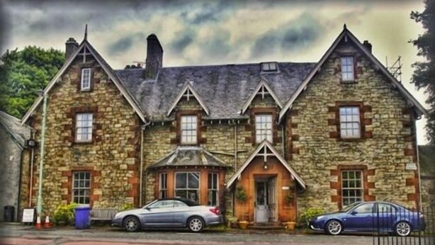 A stone building with a gabled roof and multiple windows. - The Hopetoun Arms Hotel (Biggar)