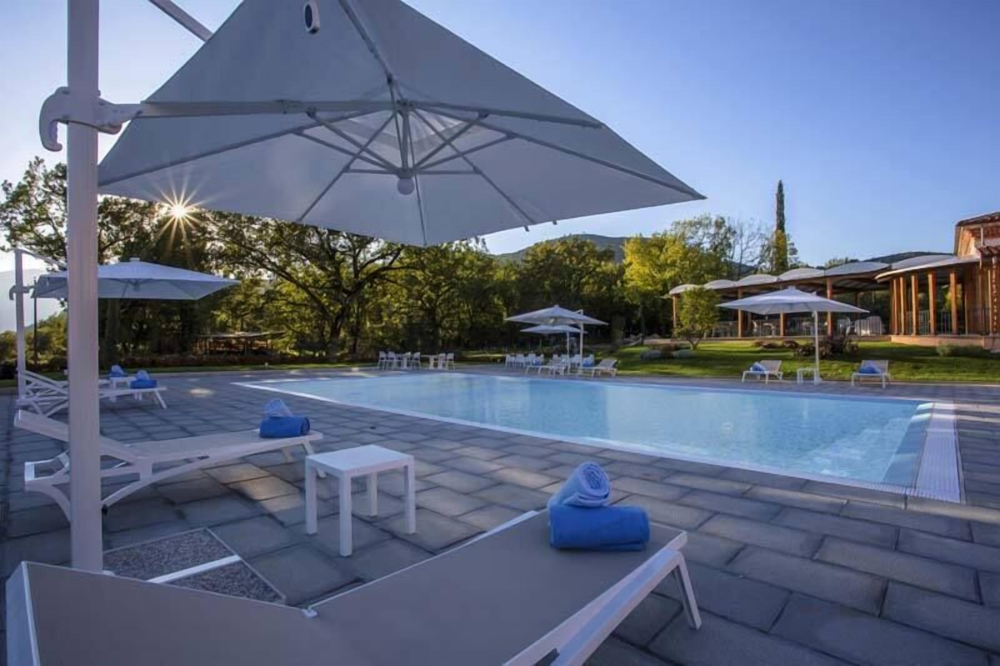 Seasonal outdoor pool, open 9 AM to 7 PM, pool umbrellas, sun loungers