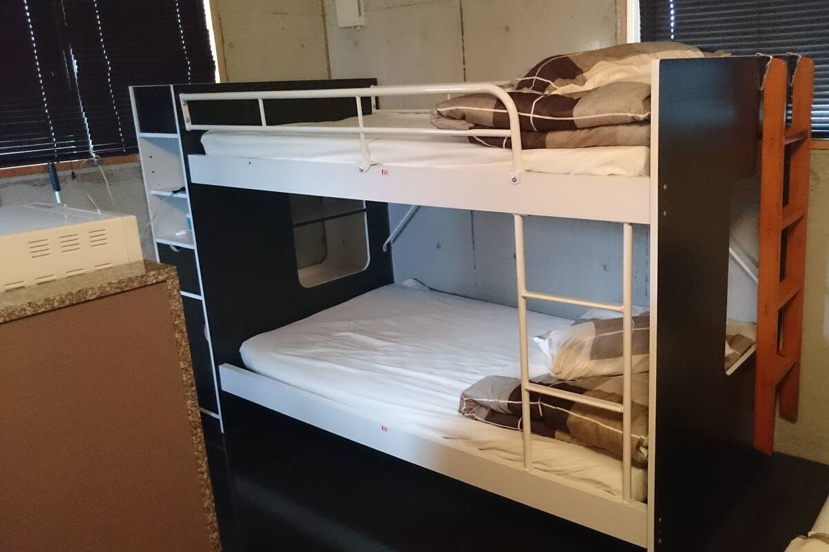 A bunk bed with a lower bunk and a top bunk.